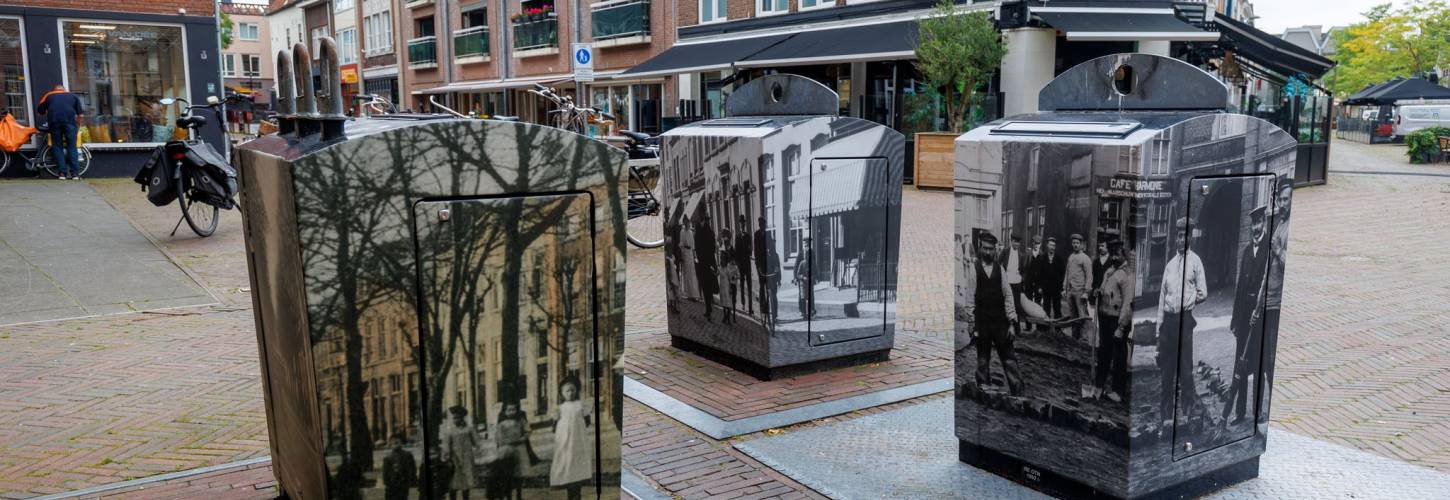vuilcontainers in de Tielse binnenstad, beplakt met beelden van begin 20e eeuw
